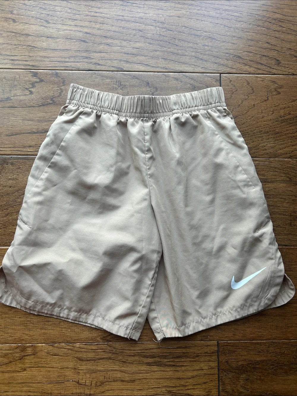 Nike Beige Athletic Shorts with White Swoosh